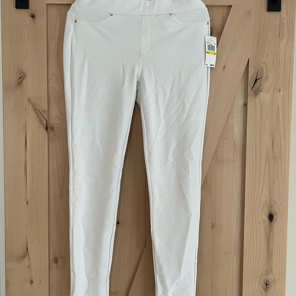 Michael Kors Jeggings. Gold grommets/pocket tag